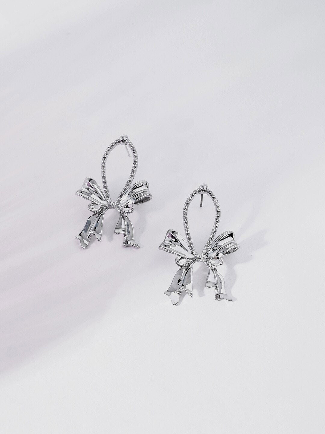 SOHI Silver-Plated Designer Drop Earrings