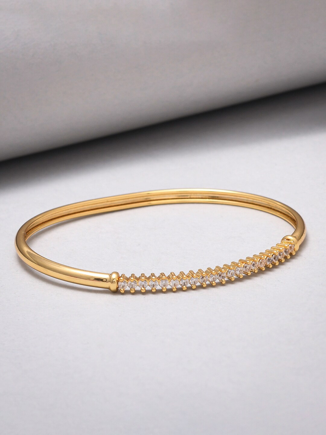 Sparkling Elegance Round Cut CZ Adorned Gold Plated Brass Bracelet