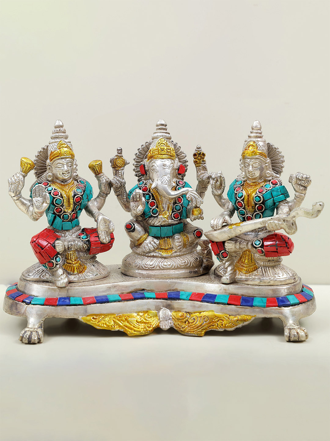Exotic India Gold Toned Three Auspicious Deities Brass Showpiece