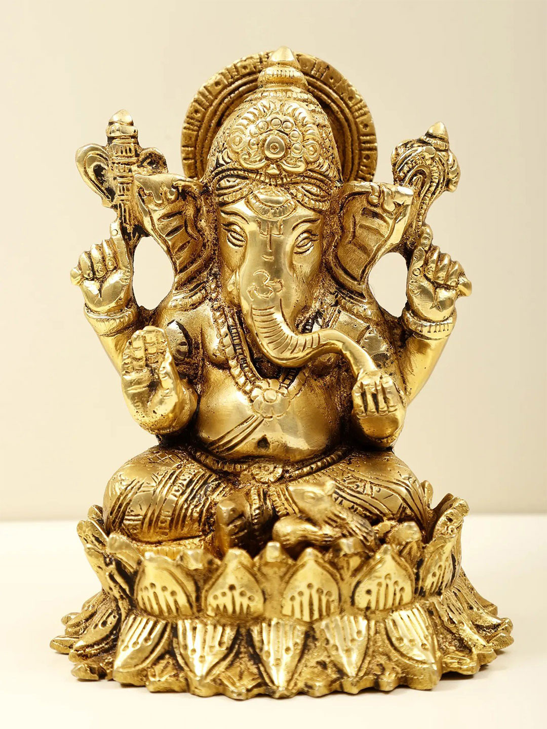 Exotic India Gold Toned Brass Lord Ganesha Religious Idol Showpiece