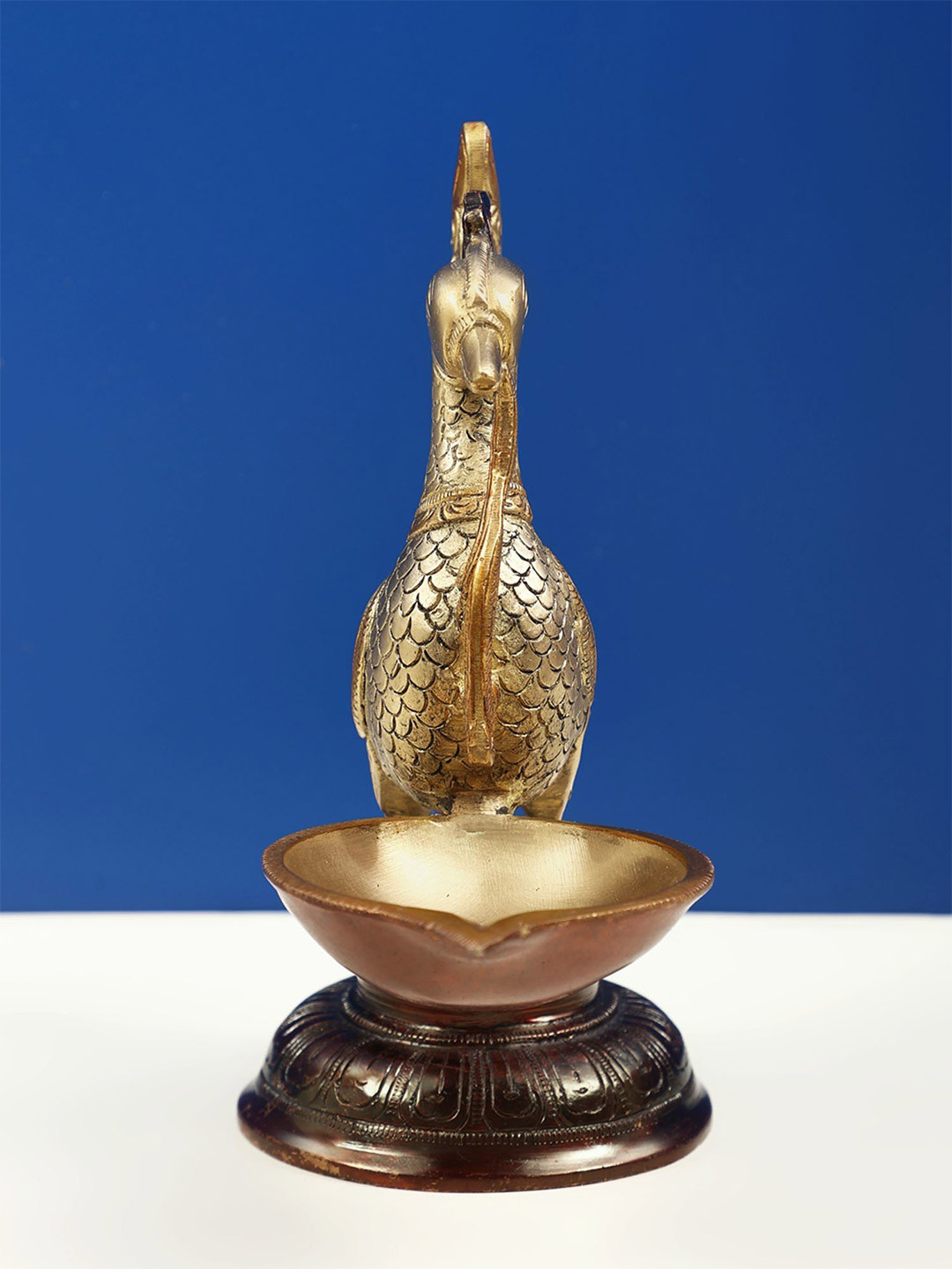 Exotic India Gold Toned Mayur Peacock Lamp Idol Showpiece