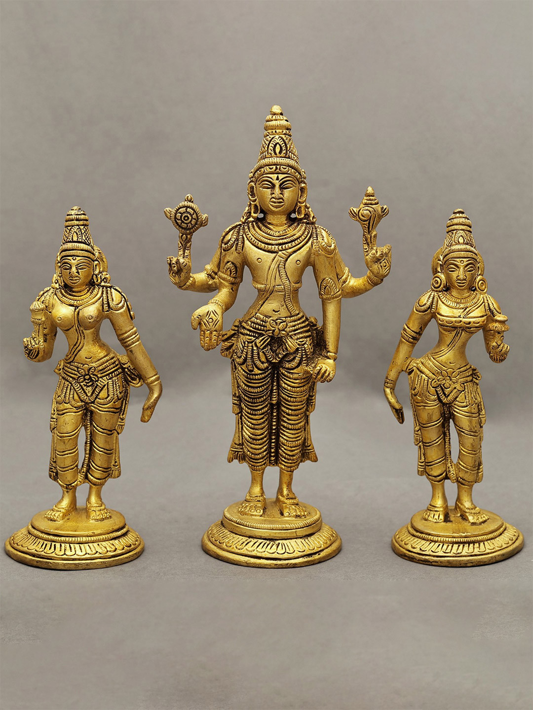 Exotic India Gold-Toned 3 Pieces Lord Vishnu with Shridevi and Bhudevi In Brass Showpieces