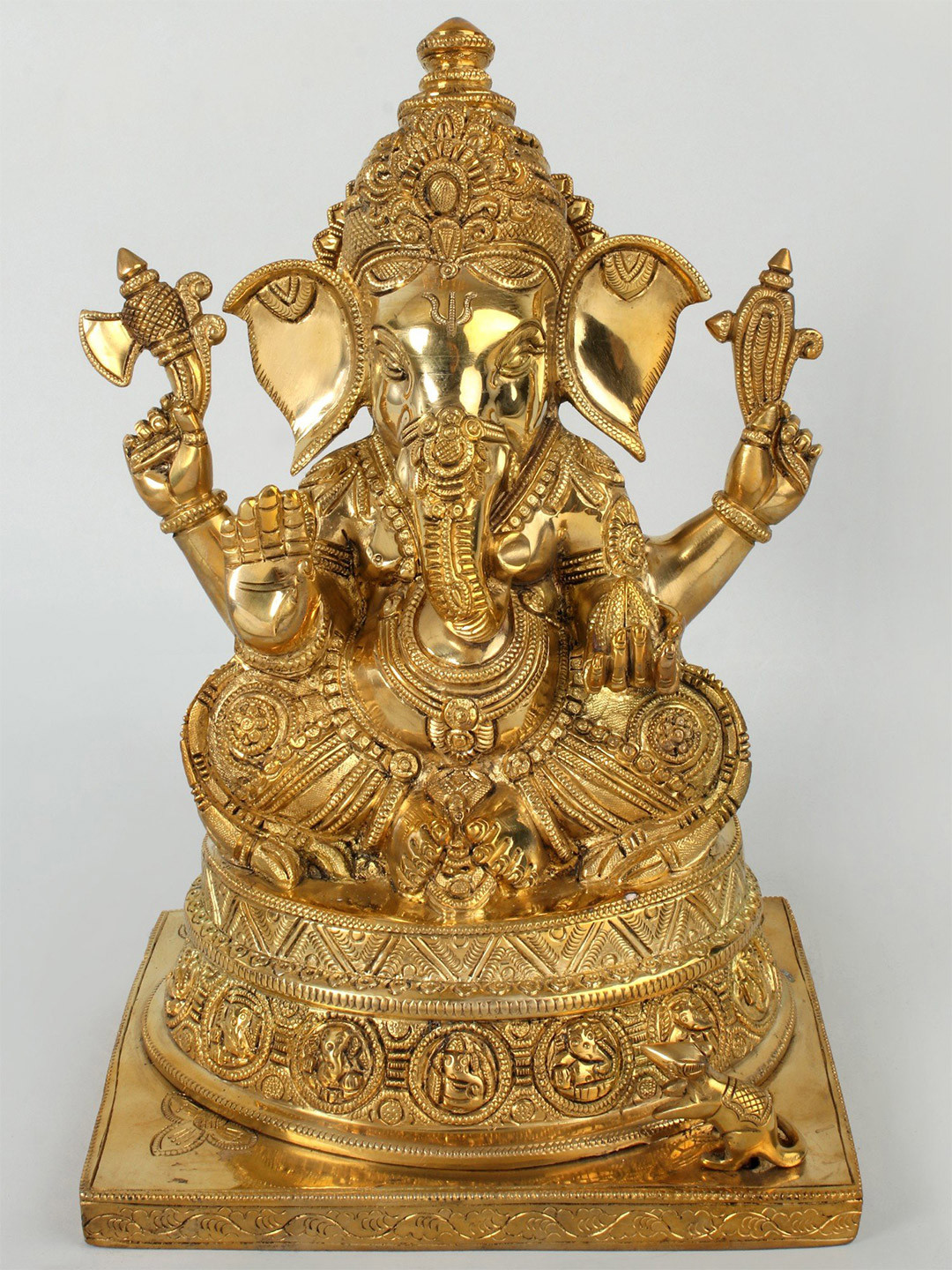 Exotic India Gold Toned Blessing Ganesha Seated On Base Carved Showpiece