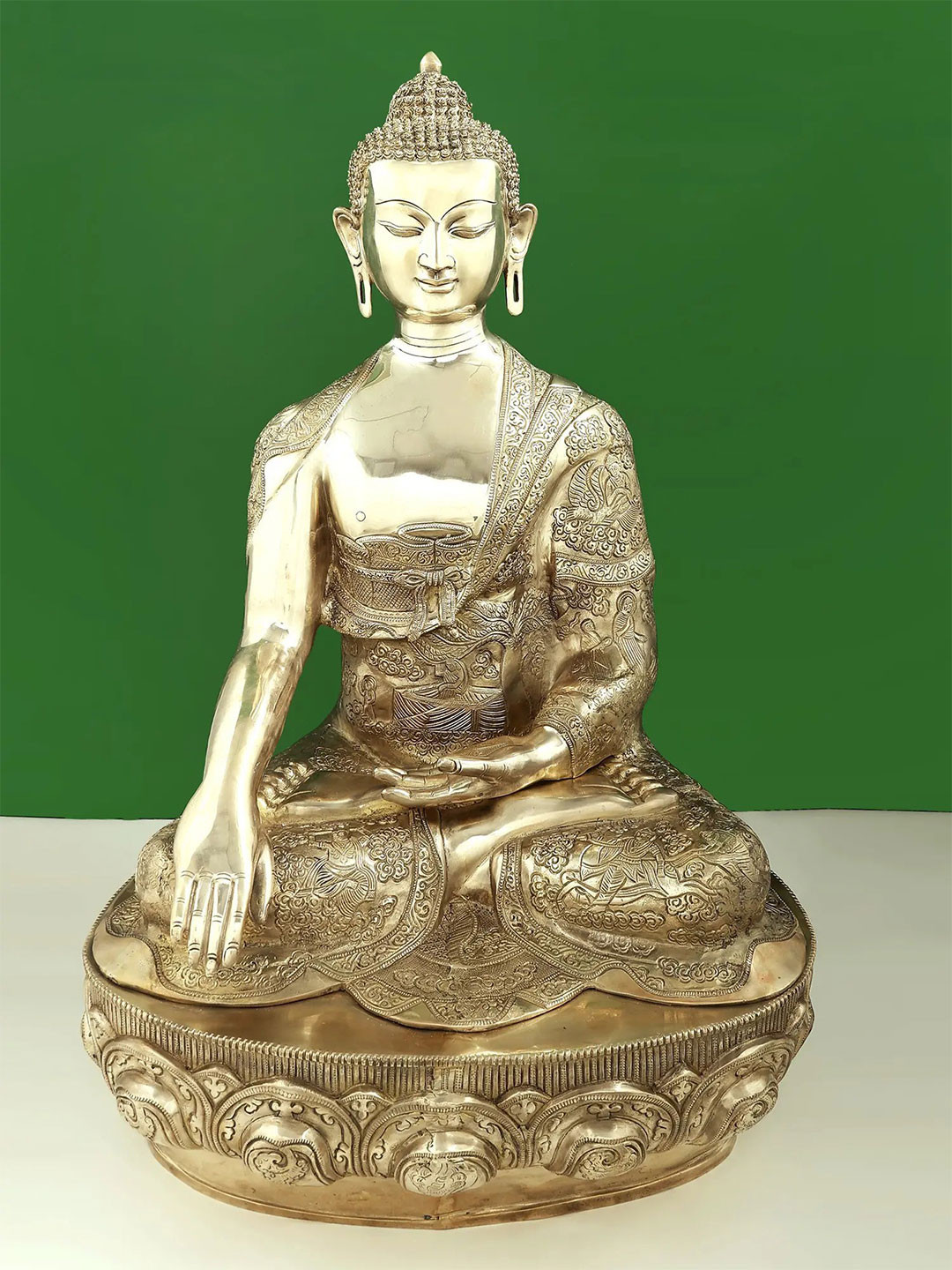 Exotic India Gold-Toned Buddha Wearing a Superb Robe Showpiece