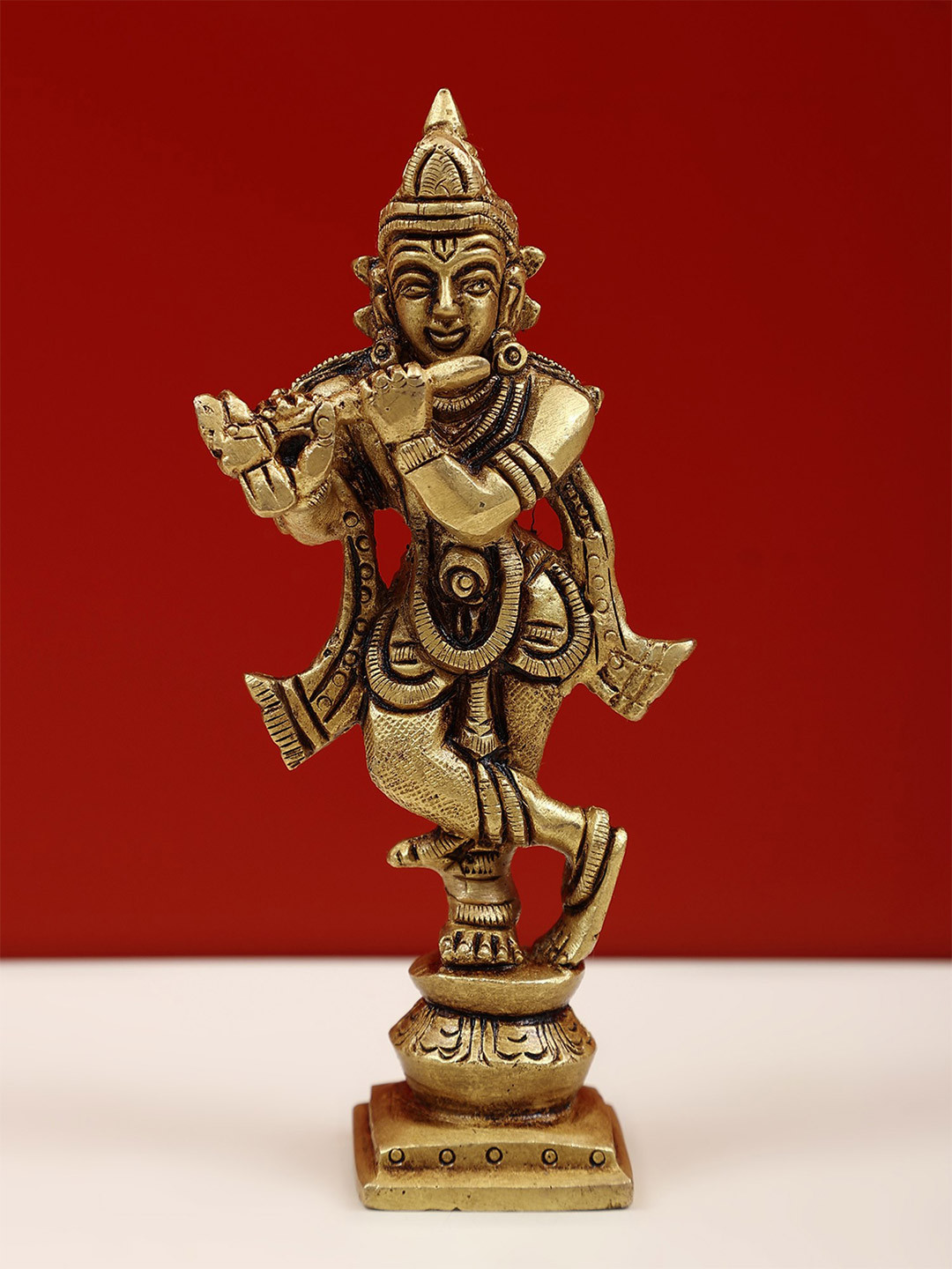 Exotic India Gold Toned Lord Krishna Playing Flute Religious Idol Showpiece