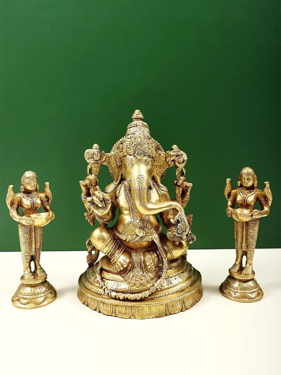 Exotic India Gold Toned 3 Pieces Lord Ganesha With Deeplakshmi Pair In Brass Showpieces