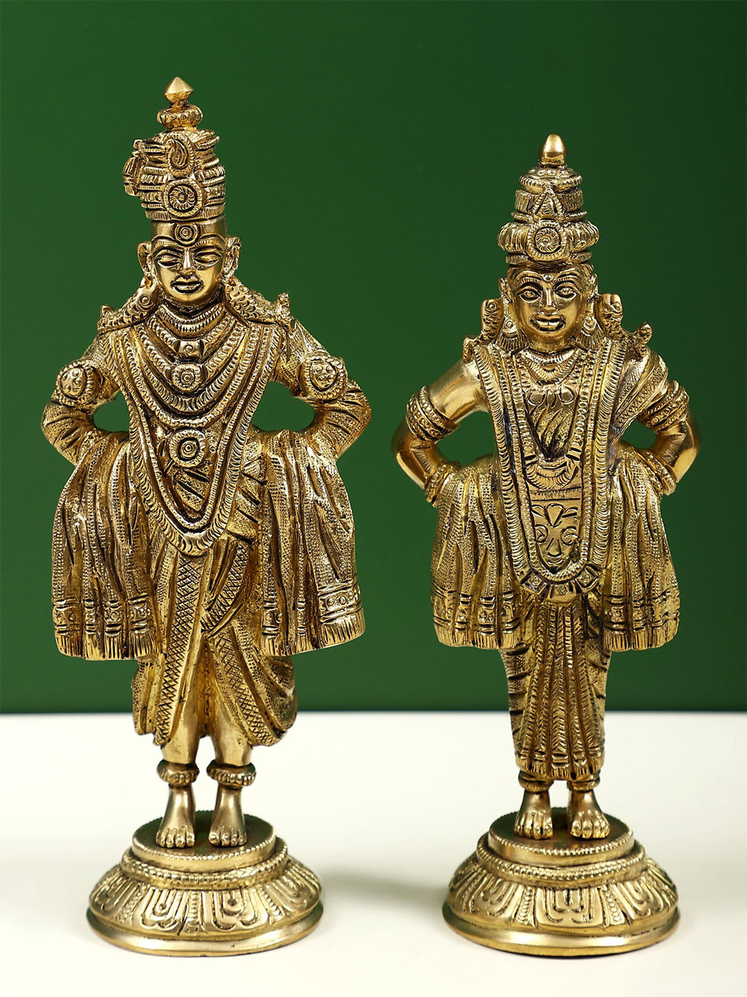 Exotic India Gold Toned 2 Pieces Lord Vitthal and Goddess Rukmini On Pedestal Showpieces