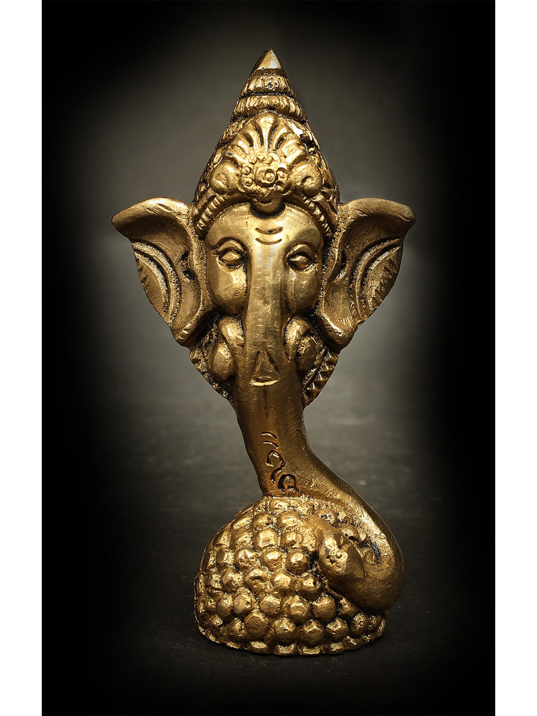 Exotic India Gold Toned Ganesha Head On Modak Stand Religious Idol Showpiece
