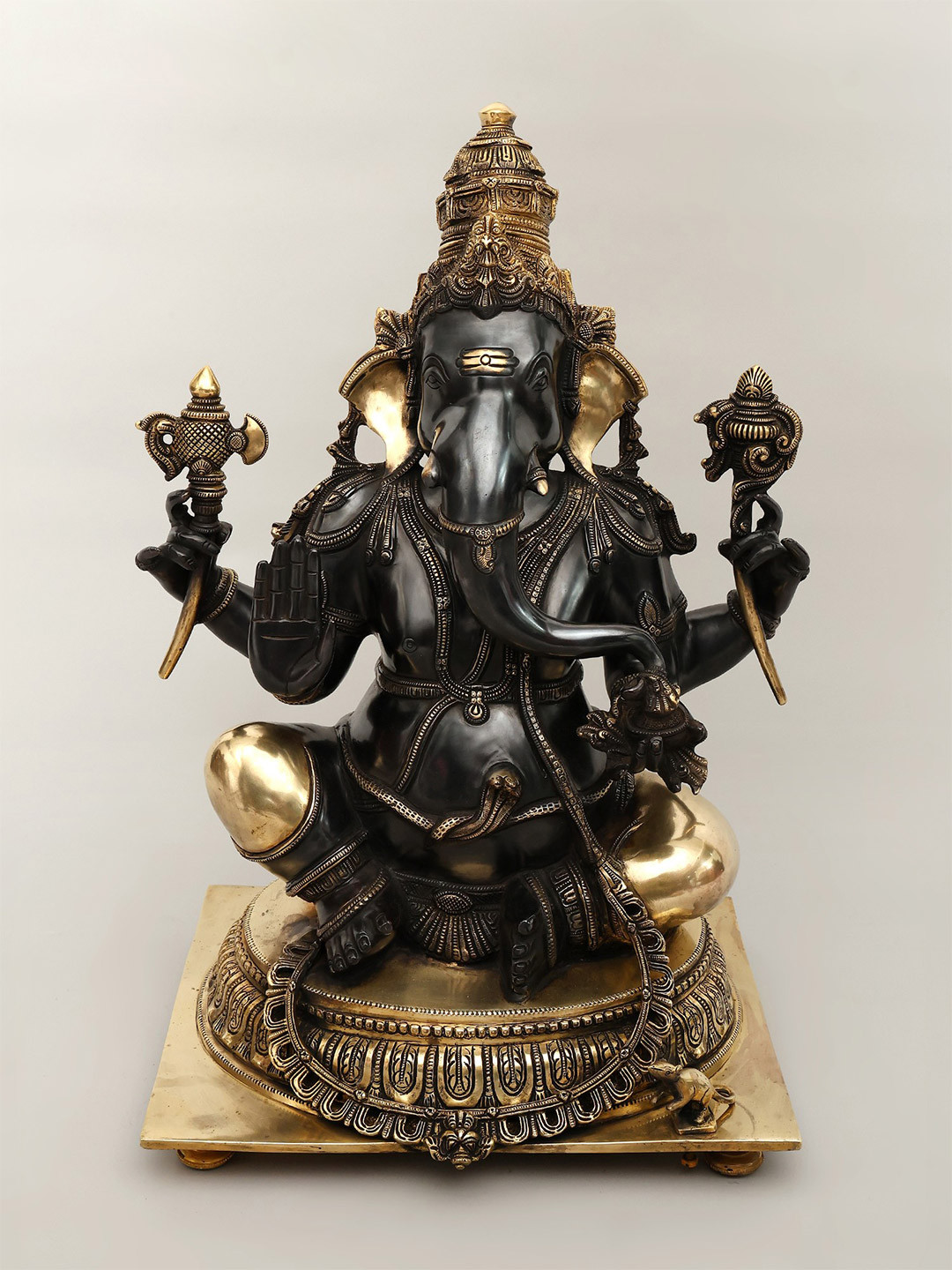 Exotic India Gold Toned & Black Brass Ganesha Granting Abhaya Showpiece