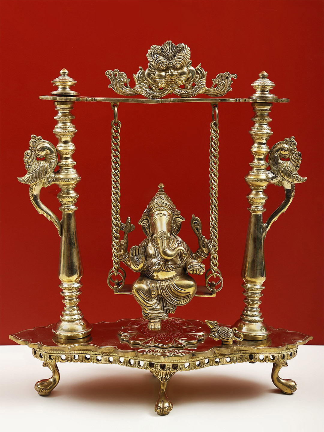 Exotic India Gold-Toned Brass Ganesha on Swing Idol Showpiece