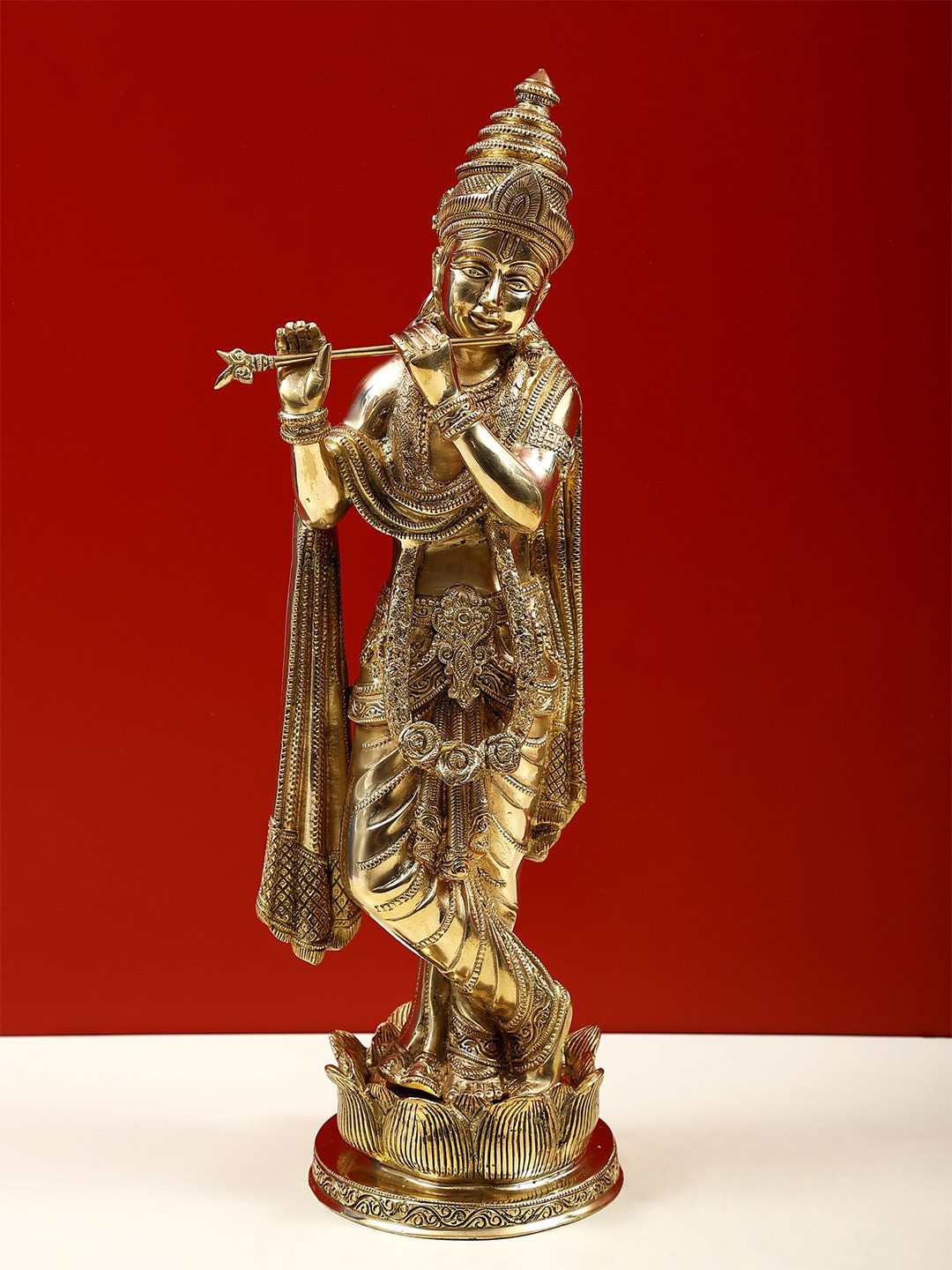Exotic India Gold Toned Lord Krishna Playing Flute on Lotus Pedestal Showpiece