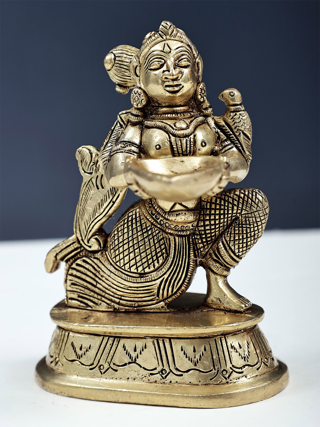 Exotic India Gold-Toned Maiden Holding Forth A Lamp In Brass Showpieces