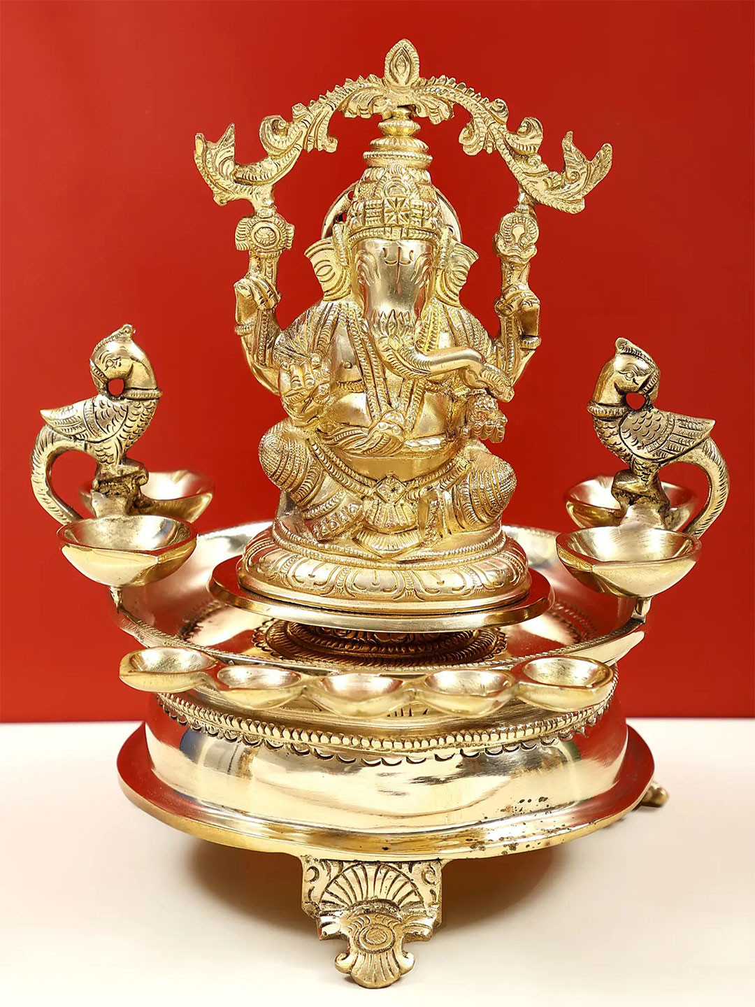 Exotic India Gold Toned Nine-Wick Lord Ganesha Lamp Brass Statue