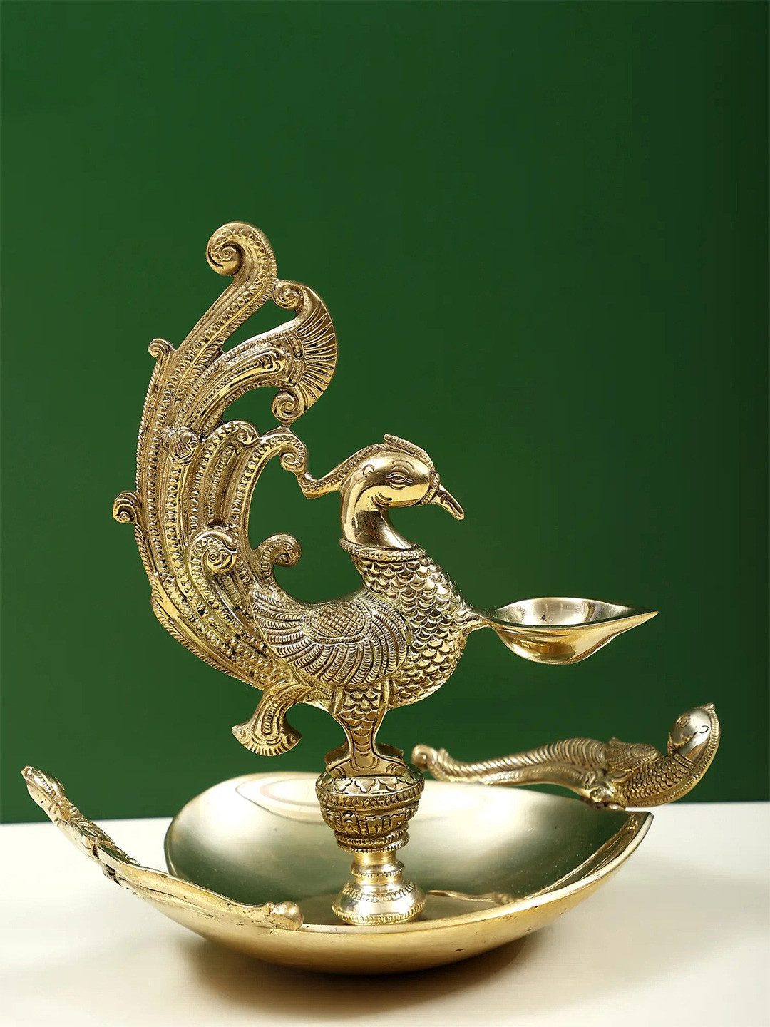 Exotic India Gold-Toned Religious Peacock Lamp Figurine Showpiece