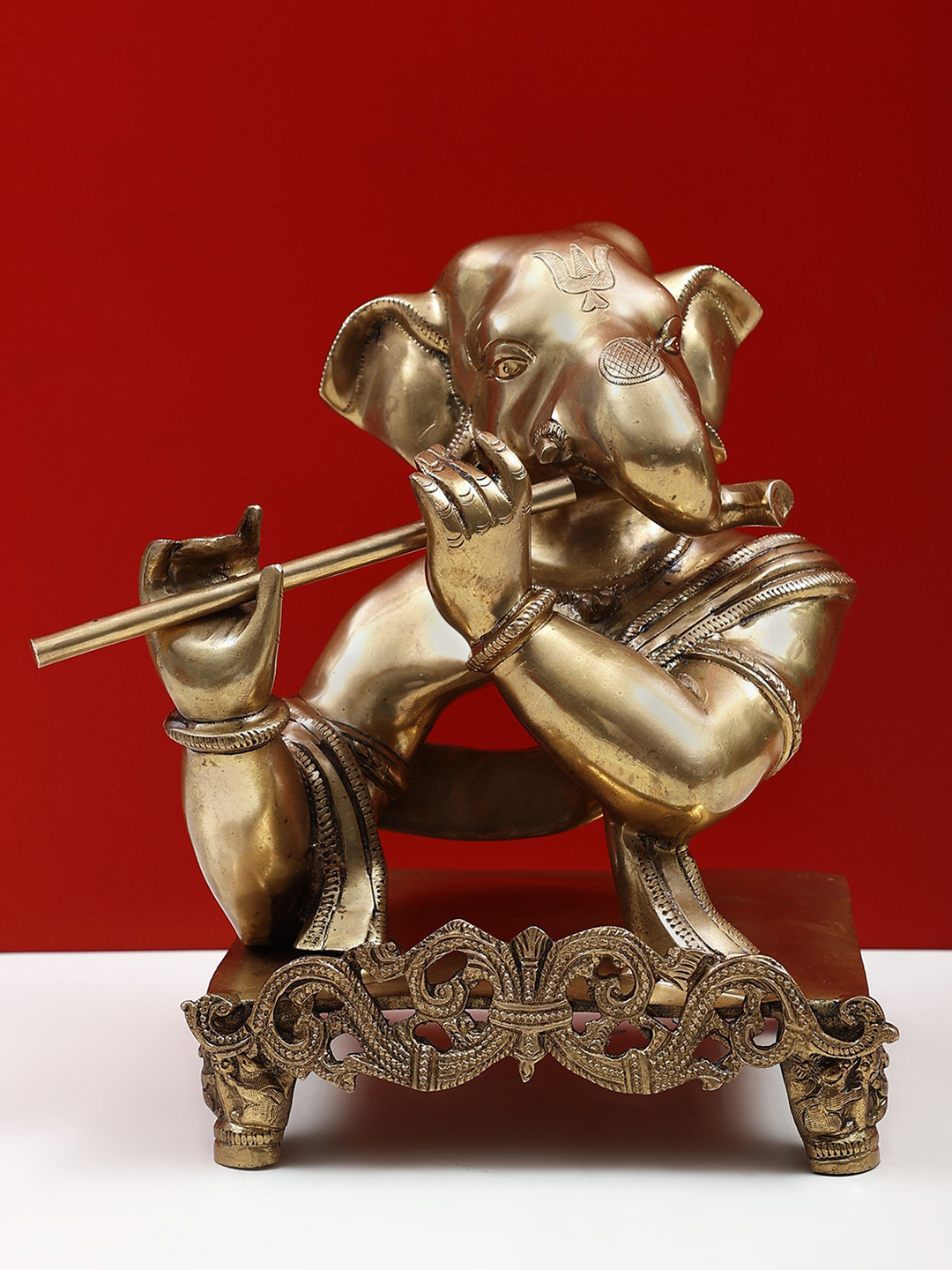 Exotic India Gold Toned The Flutist Ganesha Showpiece