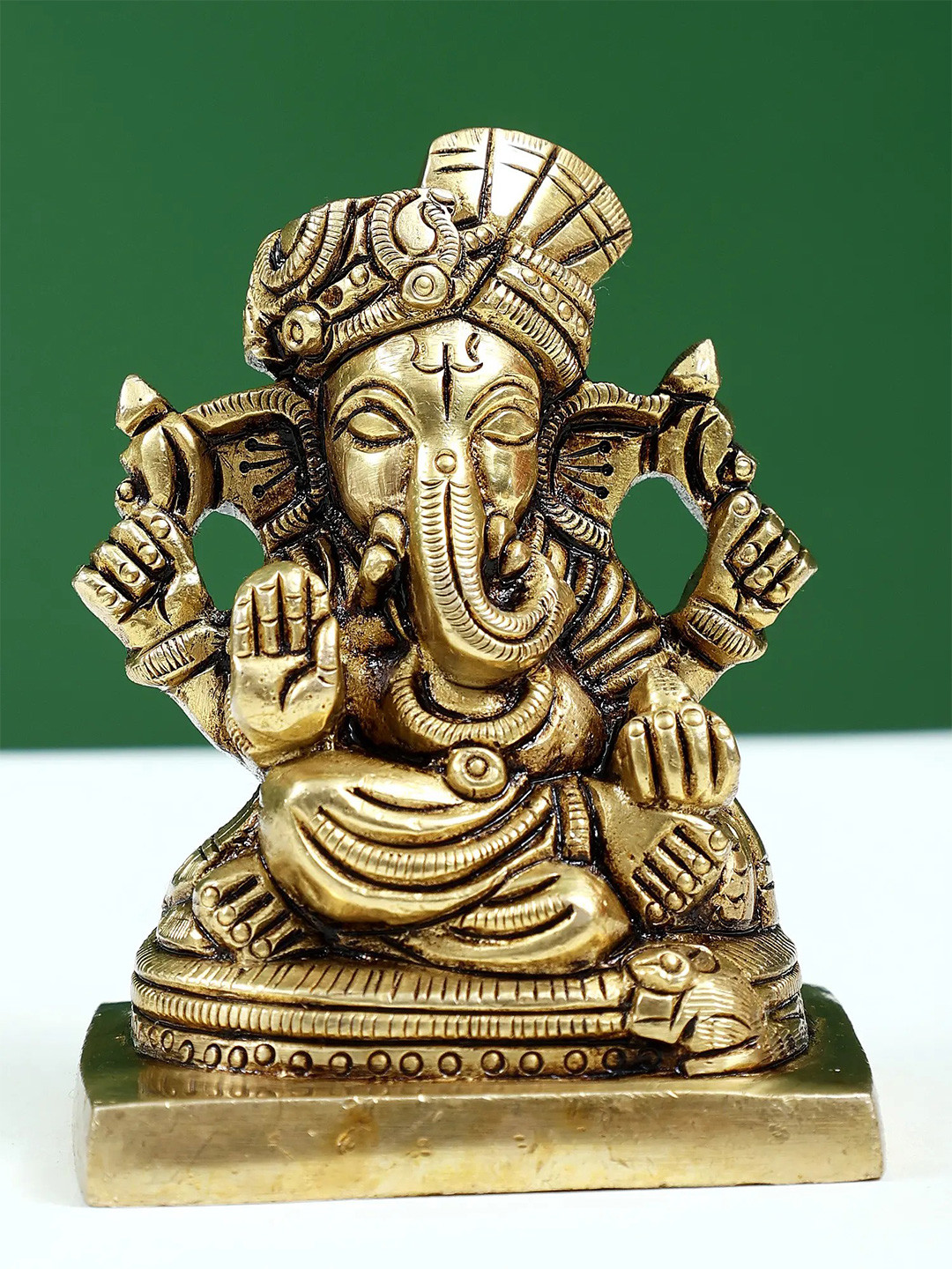 Exotic India Gold-Toned & Black Religious Raja Ganapathy Idol Showpiece