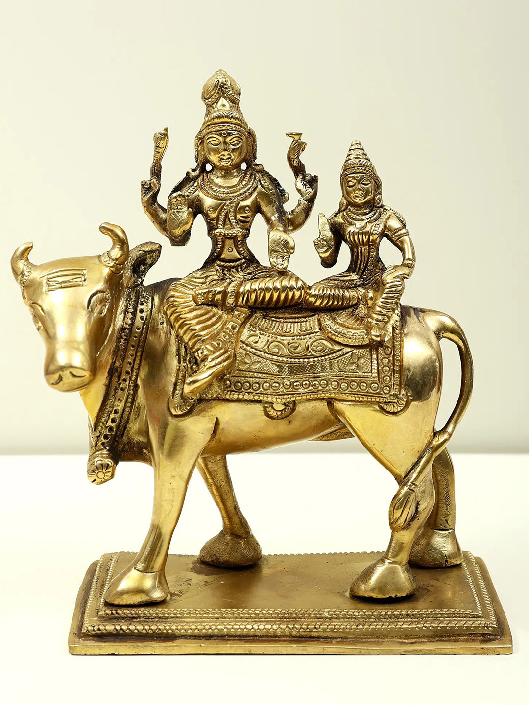 Exotic India Gold Toned Lord Shiva With Parvati On Nandi Religious Idol Showpiece