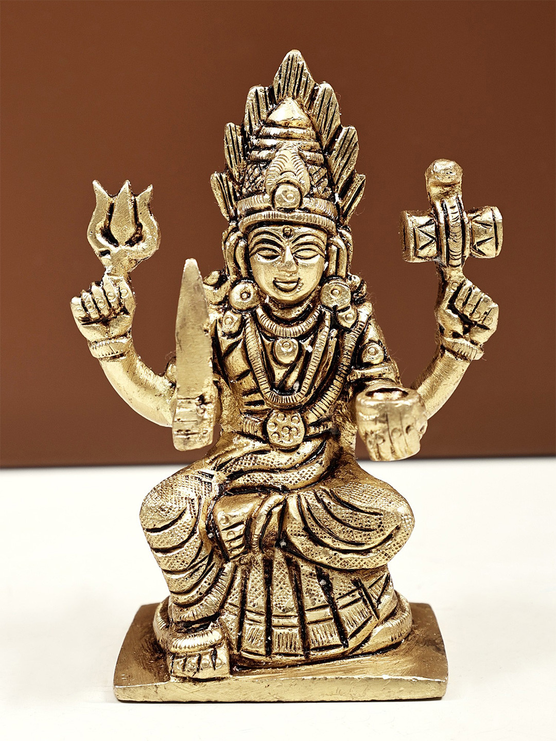 Exotic India Gold Toned Goddess Mariamman Religious Idol Showpiece