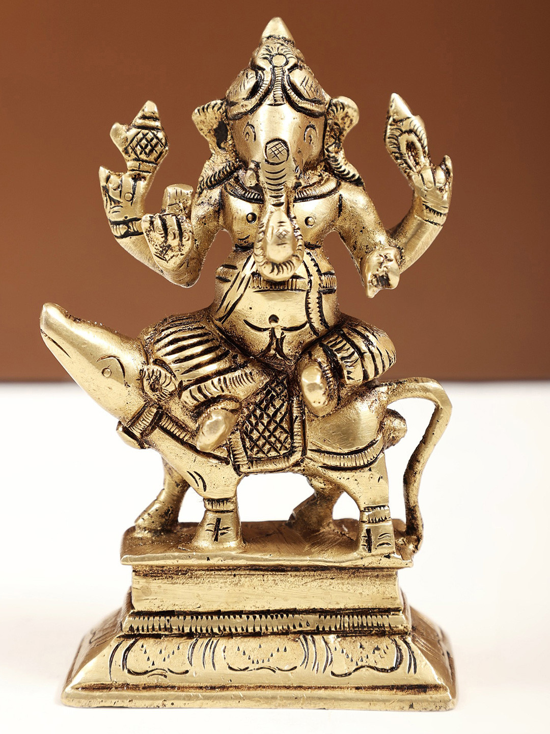 Exotic India Gold-Toned & Black Religious Ganesha Seated on Mouse Idol Showpiece