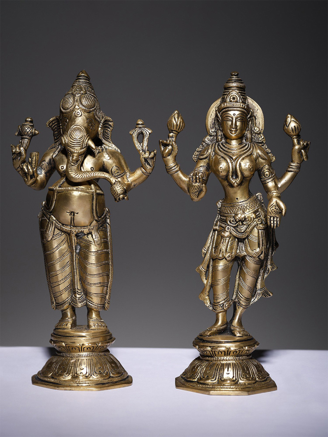 Exotic India Gold-Toned Religious Lord Ganesha and Goddess Lakshmi Idol Showpiece