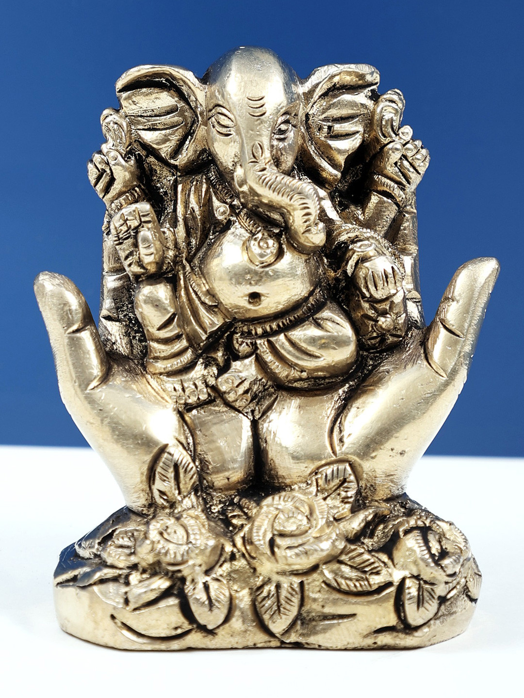 Exotic India Gold Toned Four Armed Lord Ganesha Religious Idol Showpiece
