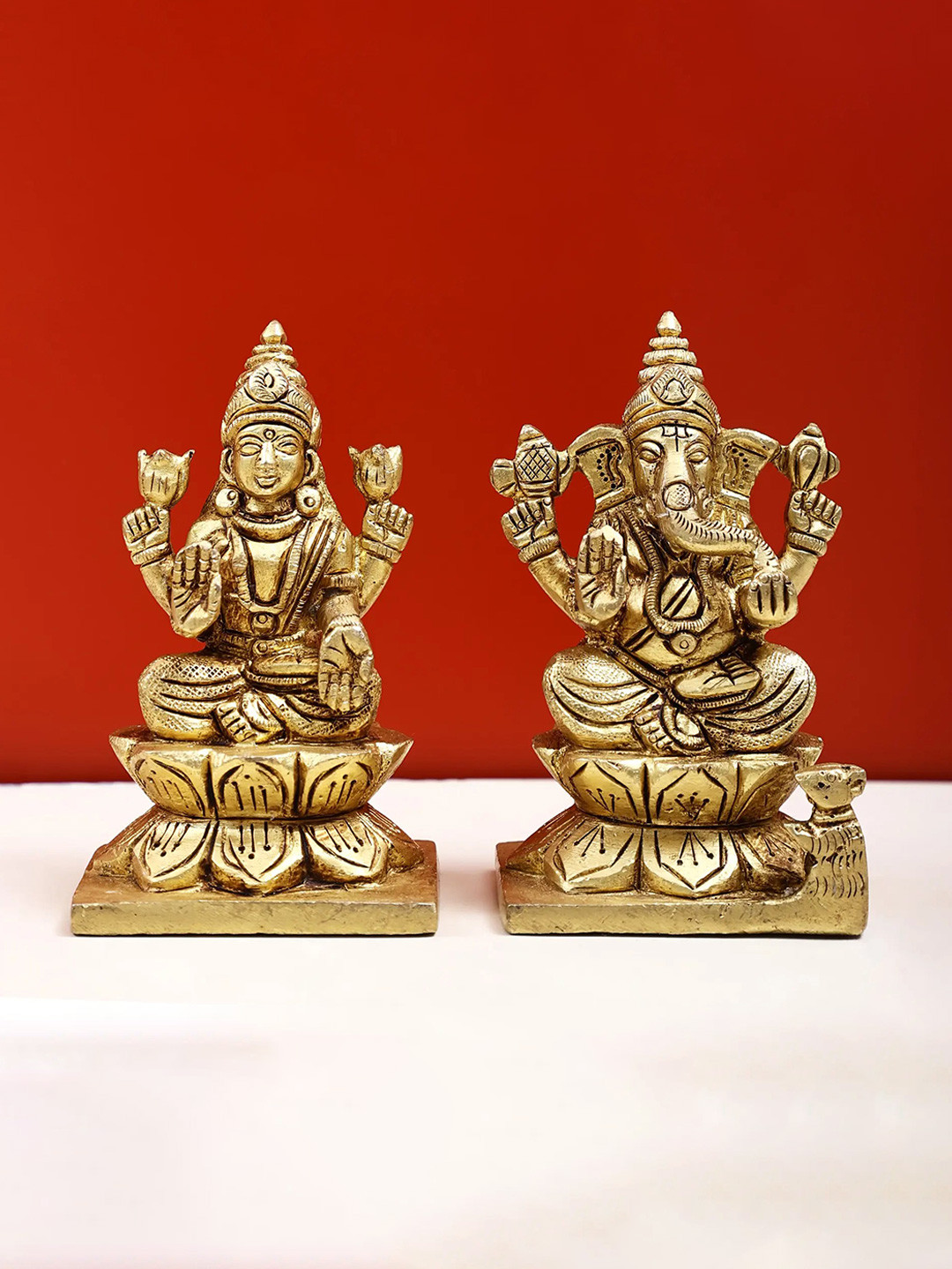 Exotic India Gold-Toned & Black Lakshmi Ganesha Sitting on Lotus Pedestal Idol Showpiece