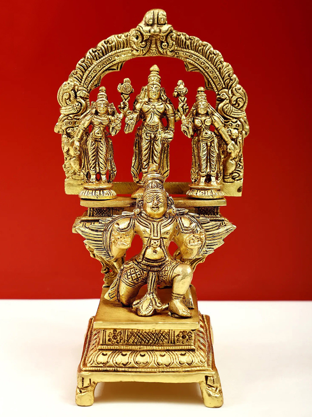 Exotic India Gold-Toned Brass Garuda Kneeling with Vishnu,Shridevi,Bhudevi Showpieces