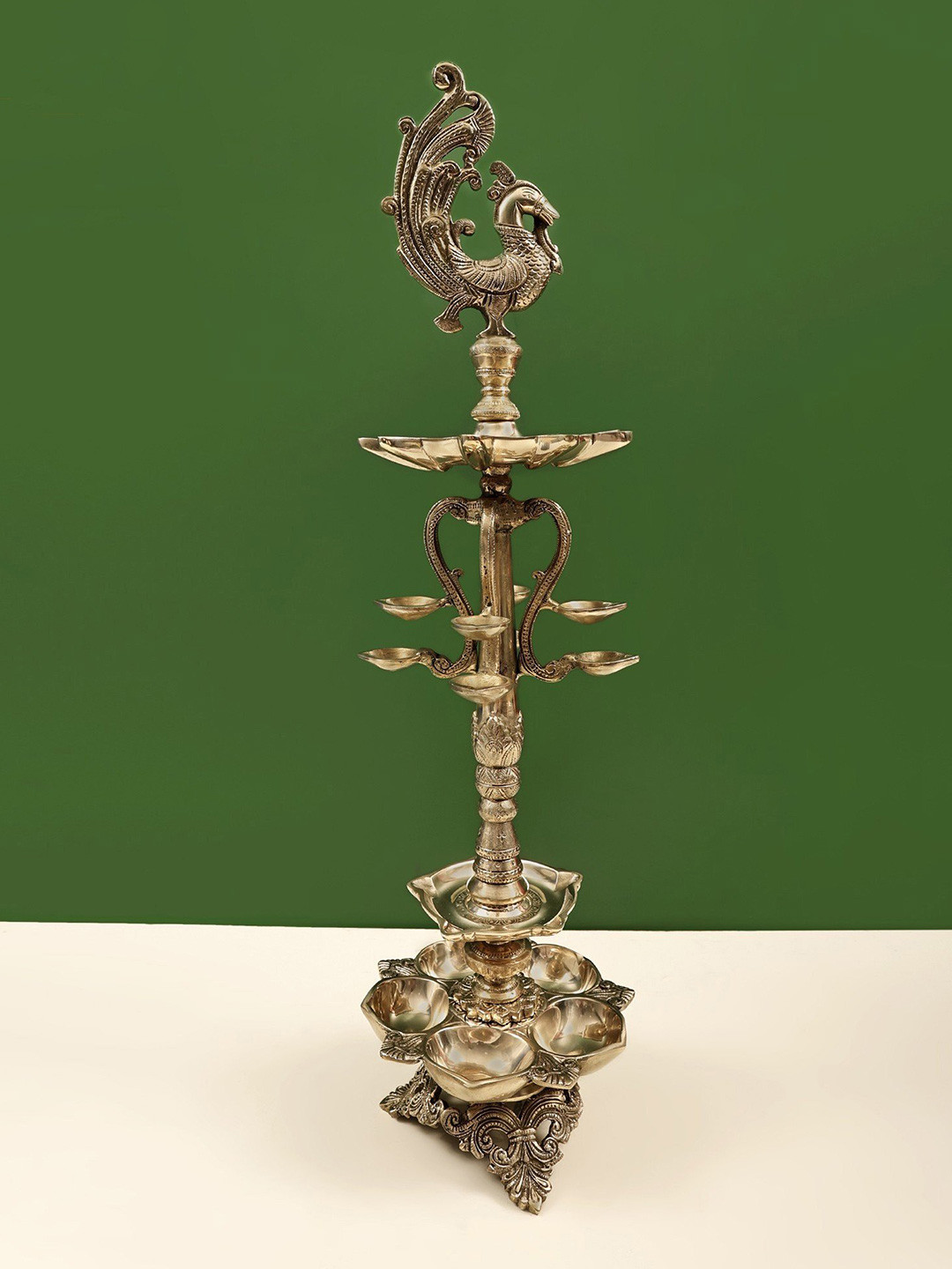 Exotic India Gold Toned Peacock Lamp Showpiece