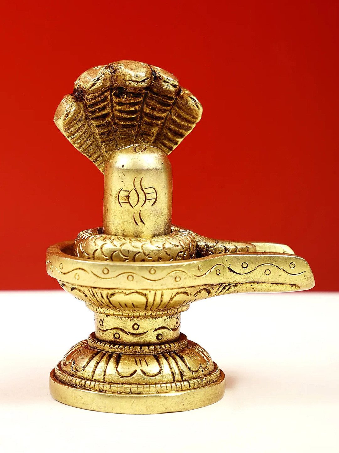 Exotic India Gold-toned & Black Religious Shiva Linga Idol Showpiece
