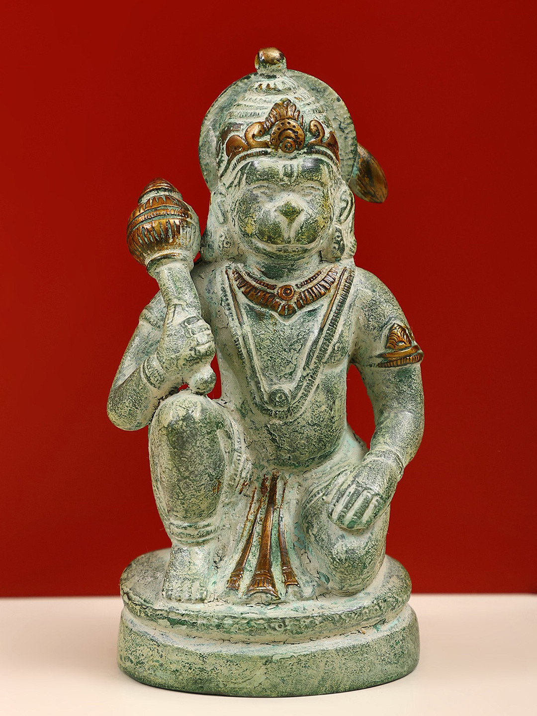 Exotic India Gold Toned & Copper Toned Seated Hanuman Showpiece
