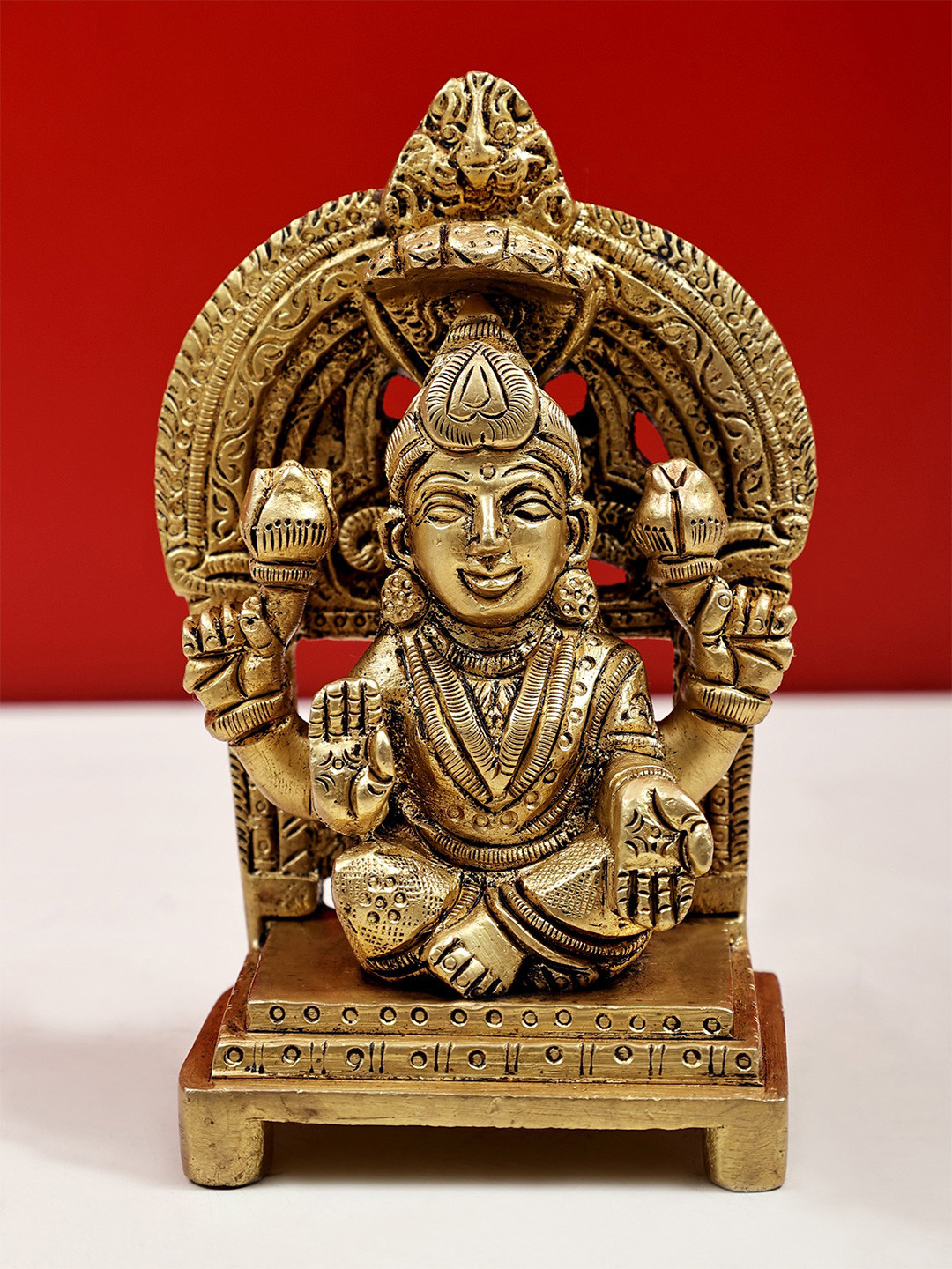 Exotic India Gold-Toned Four-Armed Lakshmi in Abhaya-Mudra Showpiece