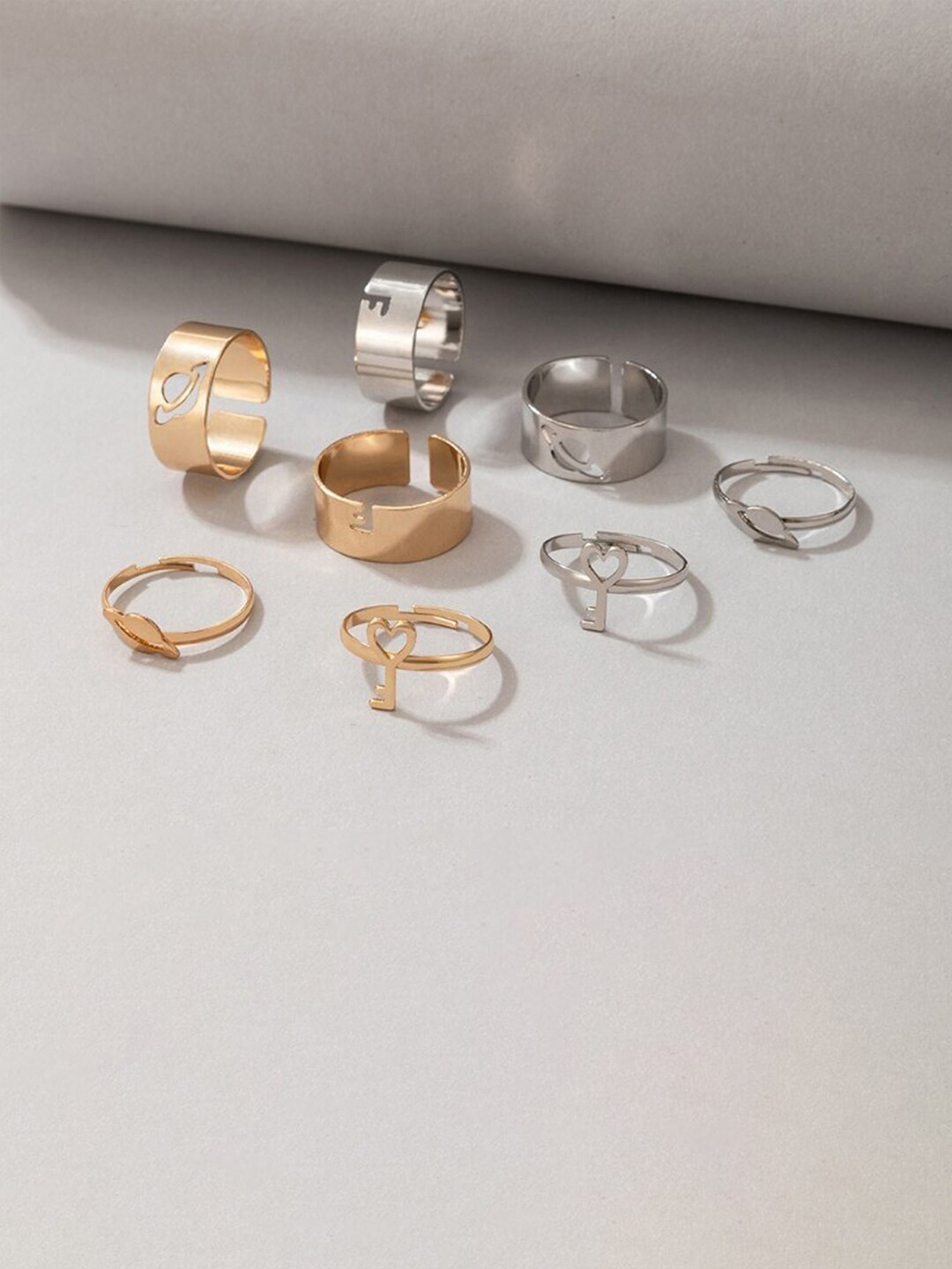 Jewels Galaxy Set Of 8 Dual-Toned & Heart-Key Design Stackable Finger Rings