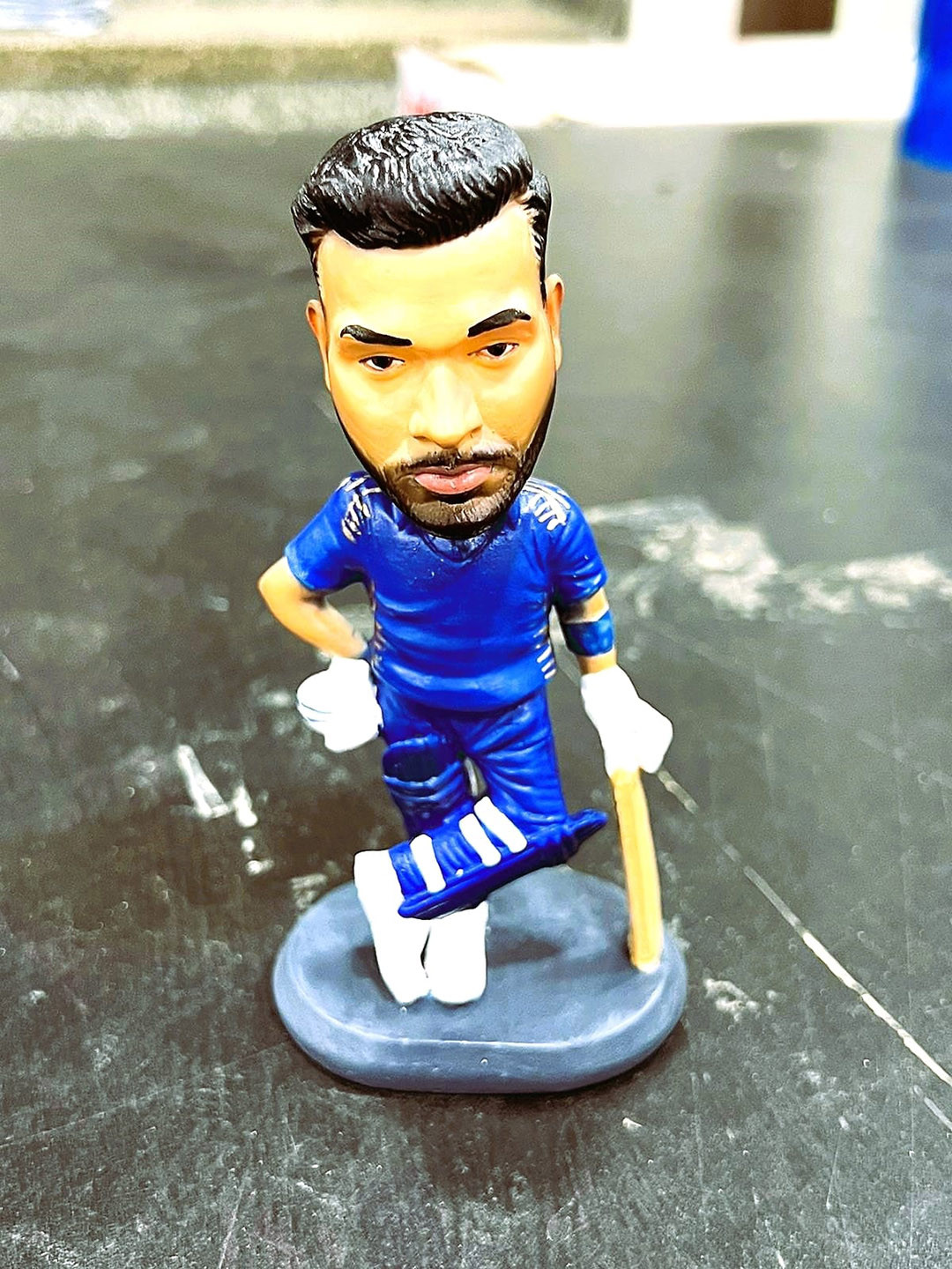 Awestuffs Bobblehead Action Blue Polyresin Natural Living Room Medium Showpiece - 5.9 Inches