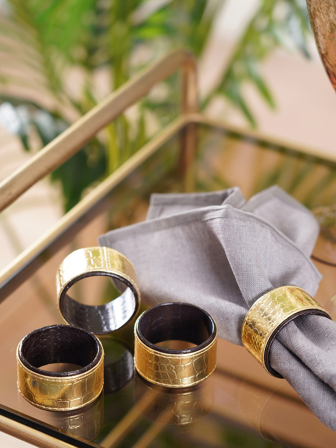 Pure Home and Living Gold Toned 4 Pcs Faux Leather Napkin Rings