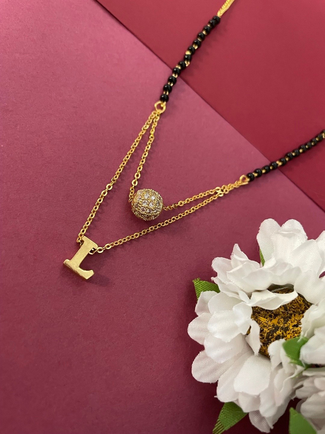 Digital Dress Room Gold-Plated L Letter Shaped AD Stone-Studded Ball & Beaded Mangalsutra