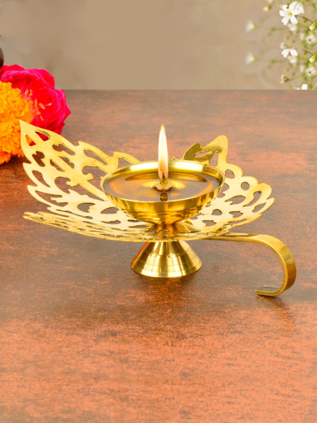 StyleMyWay Brass Textured Betel Leaf Shaped Cutwork Pooja Diya With Handle