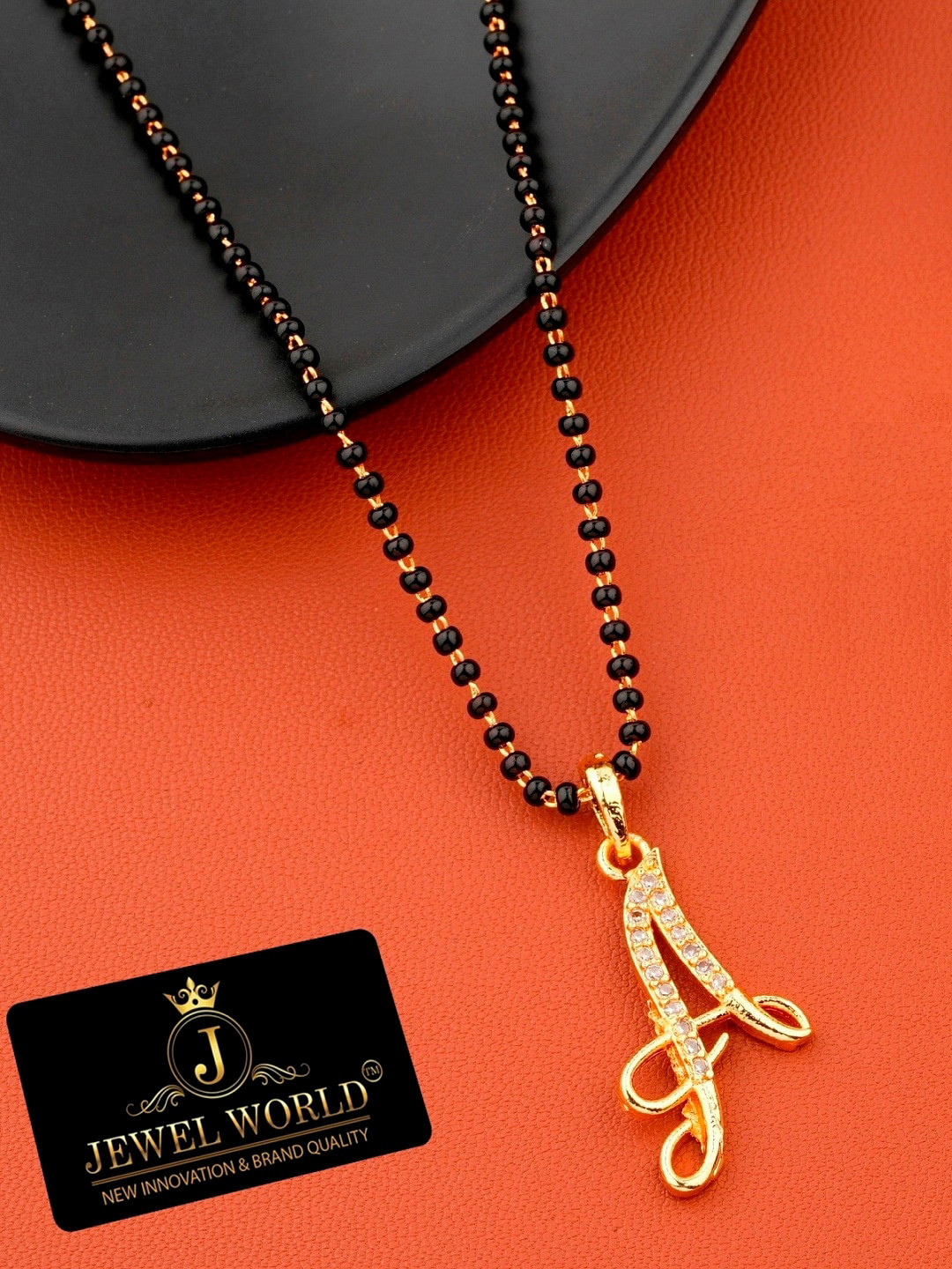 JEWEL WORLD Gold-Plated & Black Stone-Studded & Beaded Alphabet A Charm Mangalsutra