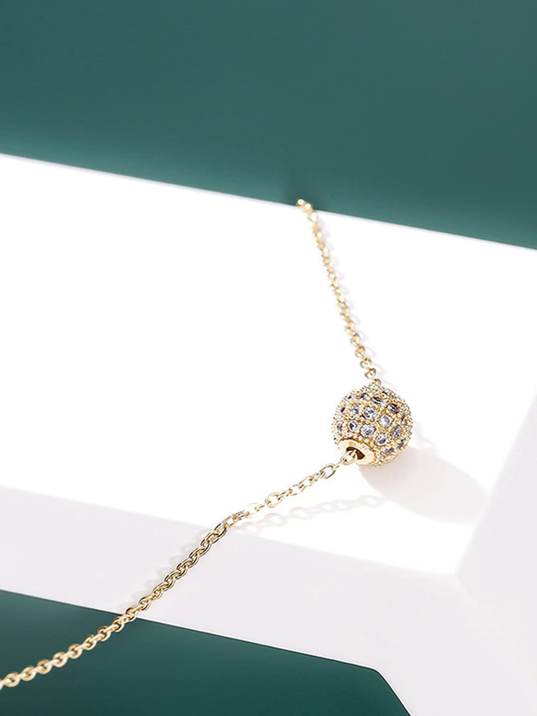 Jewels Galaxy Gold-Plated Artificial Stone Studded Spherical Pendant With Chain