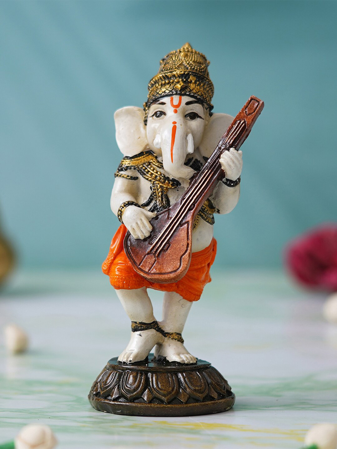 eCraftIndia Lord Ganesha Playing Sitar Musical instrument Orange Polyresin Natural Prayer Room Music Small Showpiece - 2.4 Inches