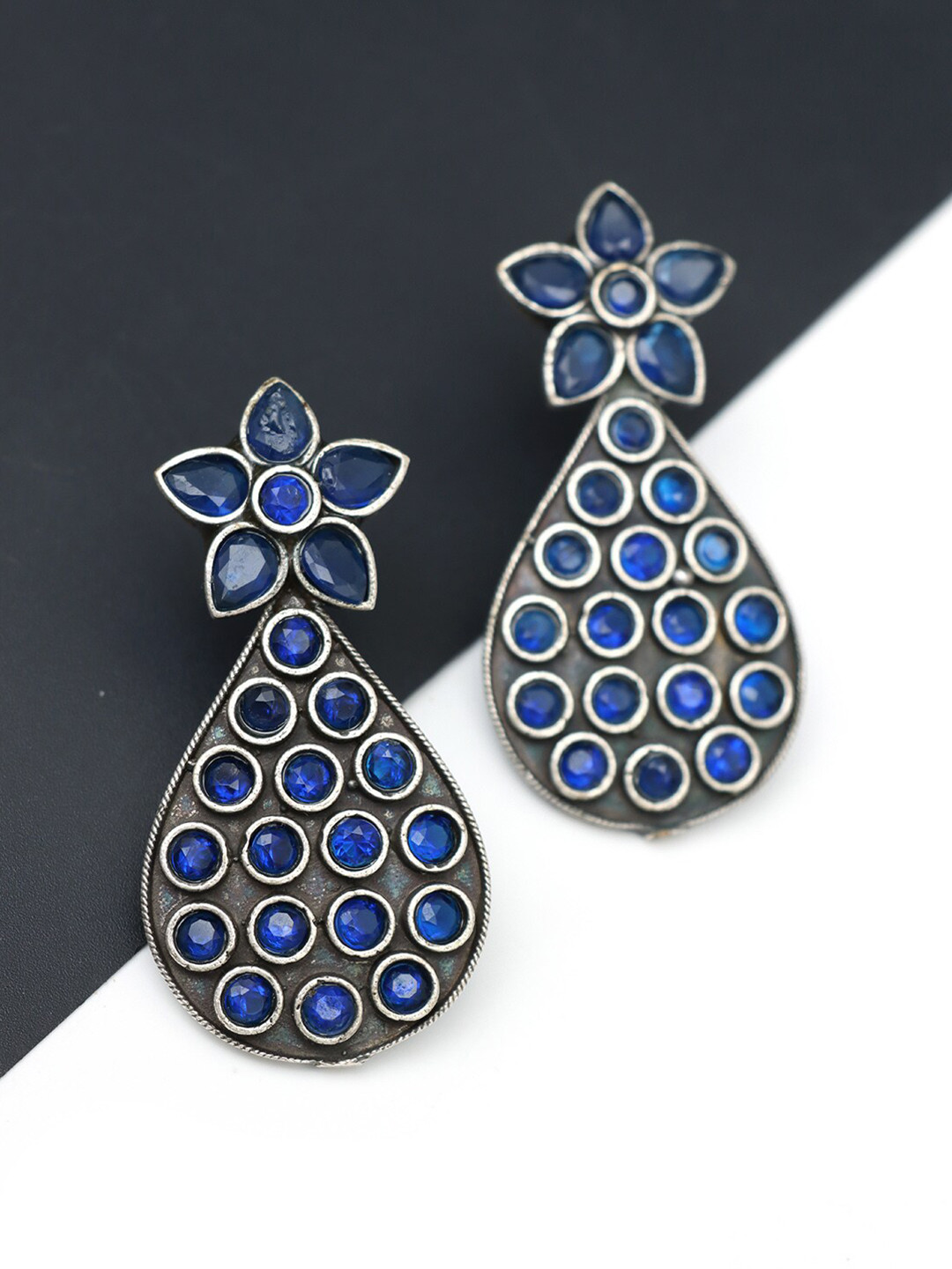 Ozanoo Silver-Plated Floral Stone Studded Jumka Earrings