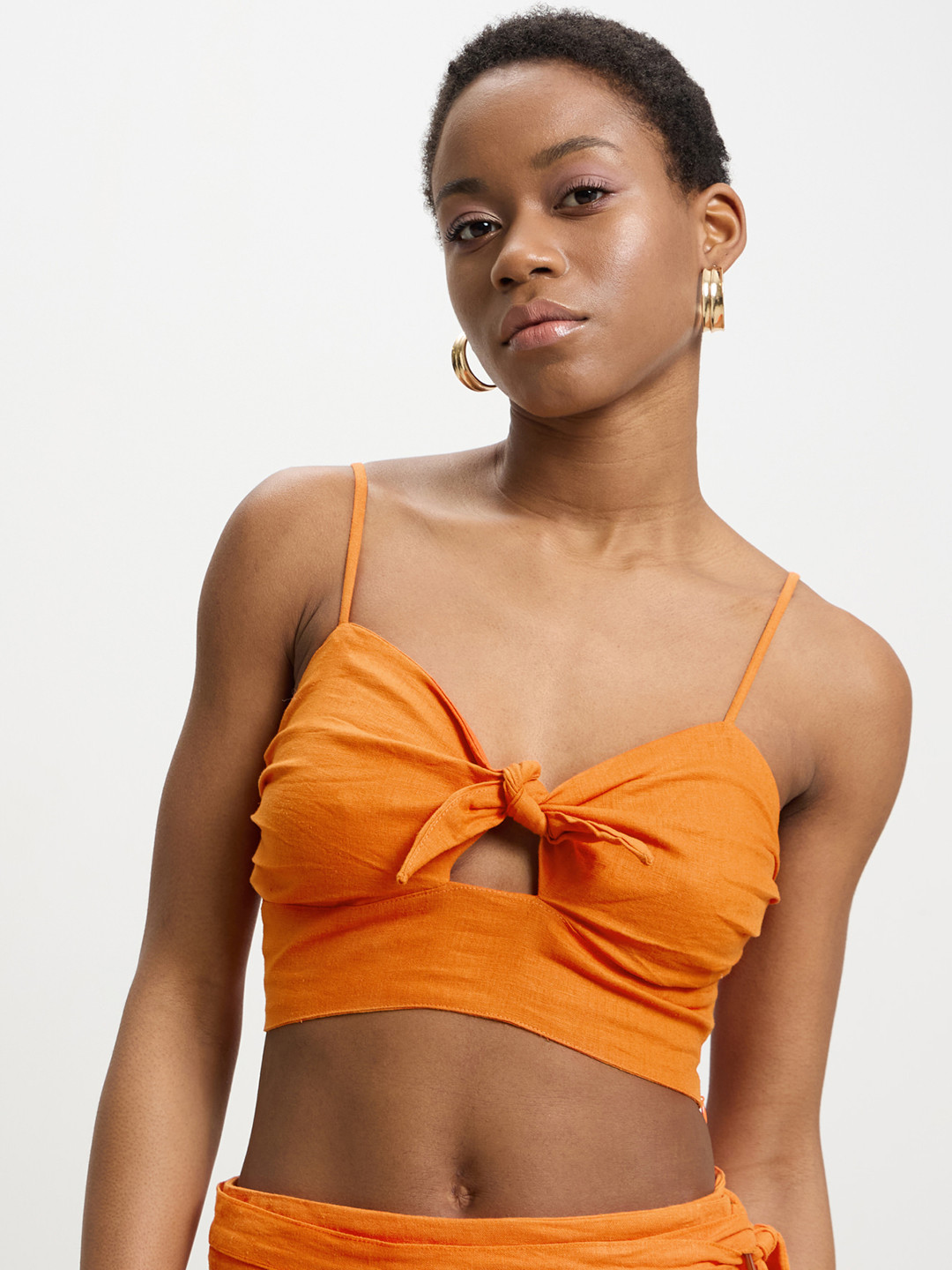 CALLIOPE Smocked Knotted Crop Top