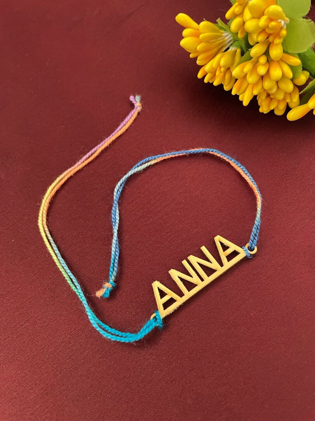 Digital Dress Room Gold-Plated Anna Slogan Rakhi
