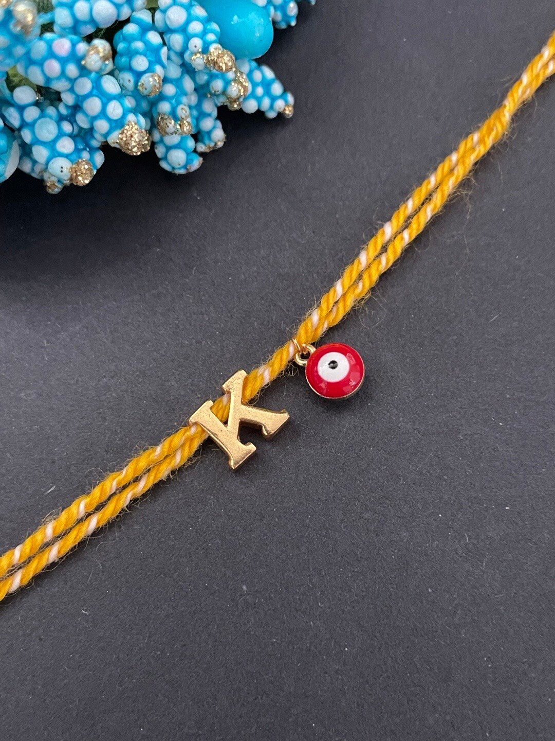 Digital Dress Room Gold-Plated K Alphabet & Evil Eye Charm Rakhi