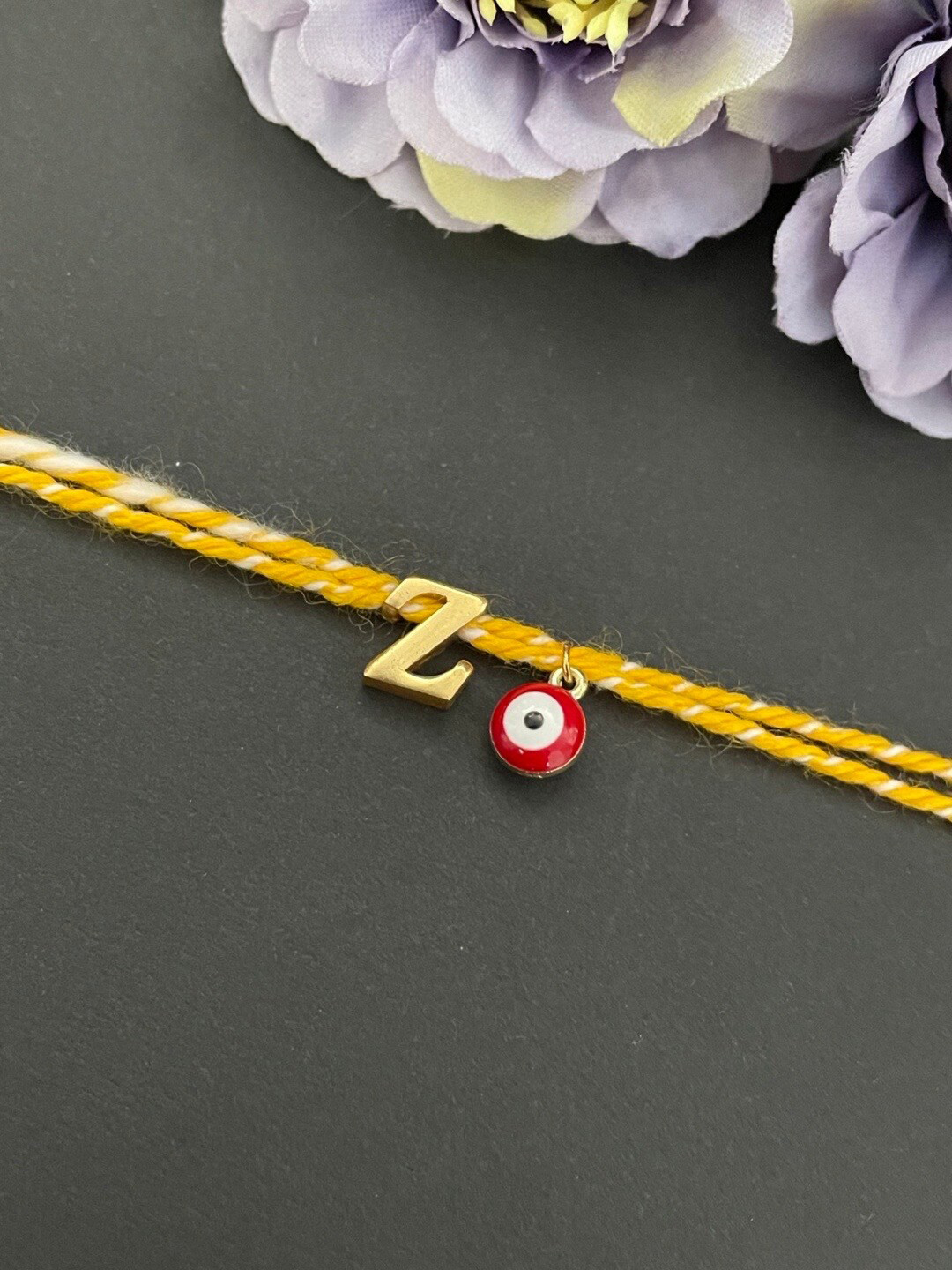 Digital Dress Room Gold-Plated Z Alphabet & Evil Eye Charm Rakhi
