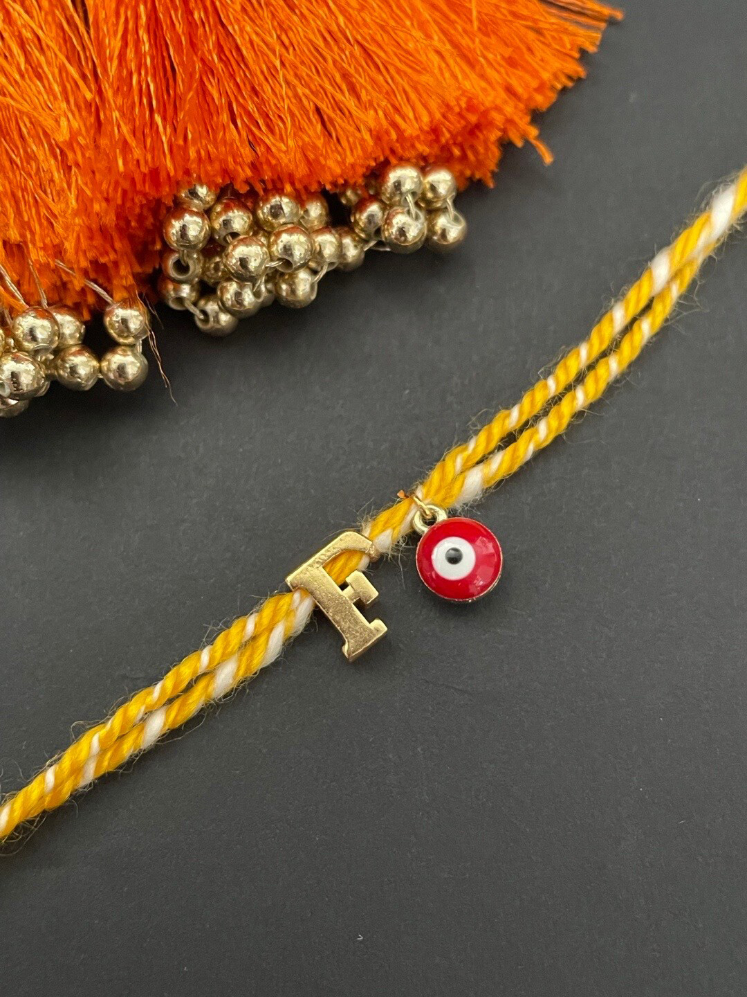 Digital Dress Room Gold Plated Letter F Initial & Evil Eye Charm Rakhi