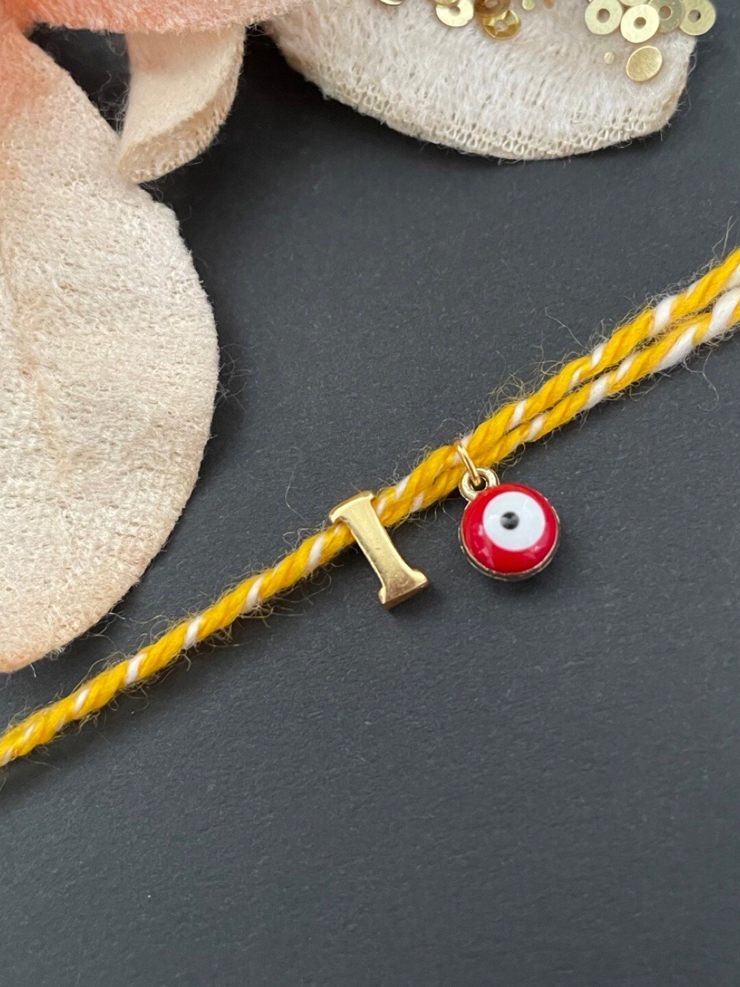 Digital Dress Room Gold-Plated I Alphabet & Evil Eye Charm Rakhi