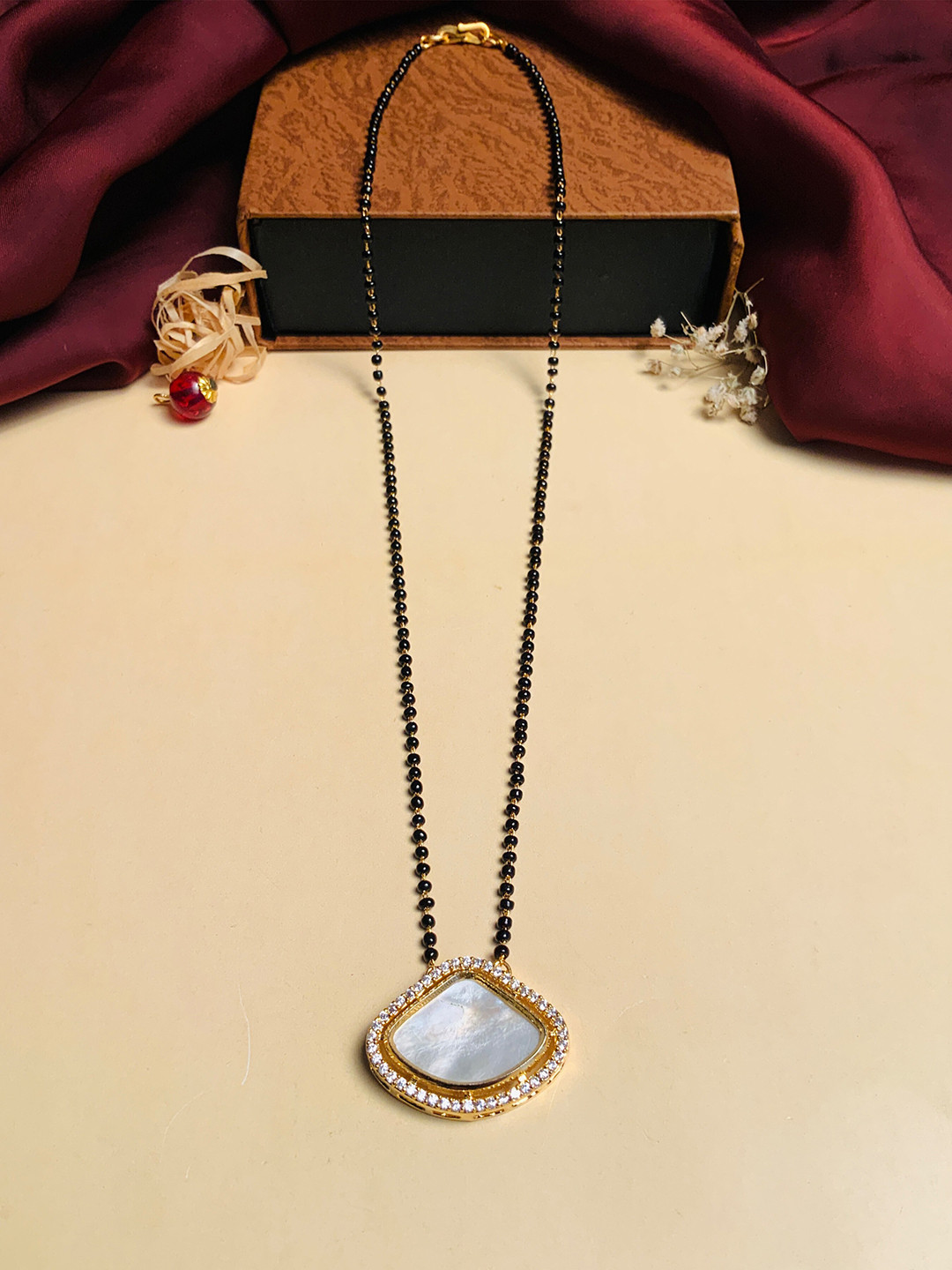 ABDESIGNS Gold-Plated Black Beaded Mother Pearl & American Diamond Mangalsutra