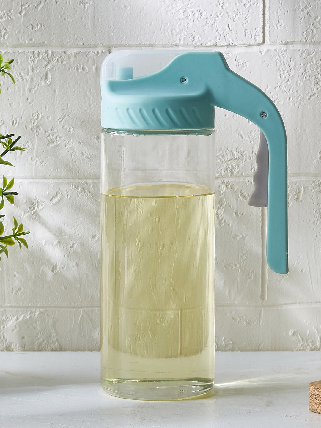 Home Centre Transparent & Teal Green Glass Oil Bottle With Press Button 400 ml