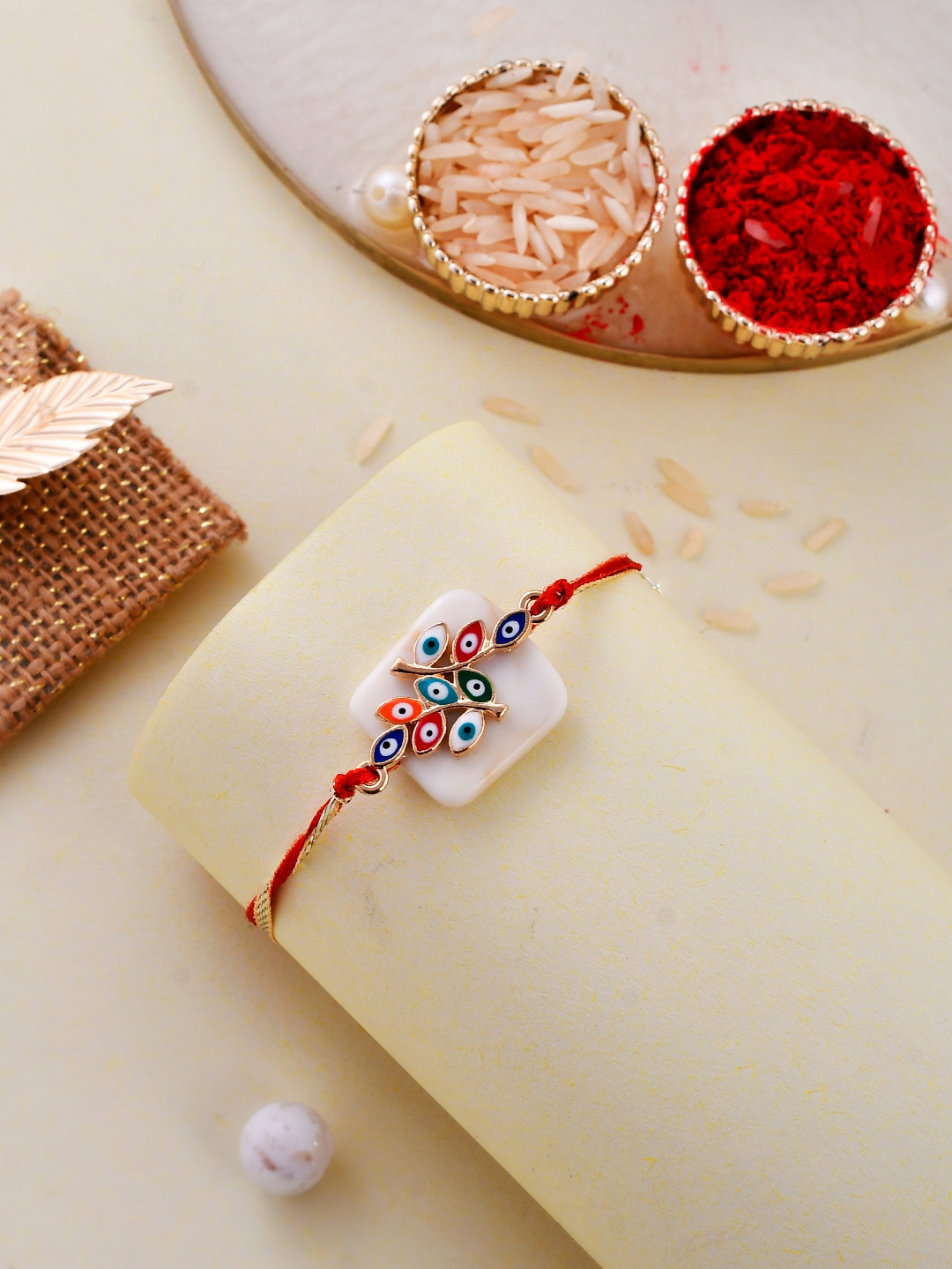 Aapno Rajasthan Gold-Plated Evil Eye Embellished Resin Rakhi