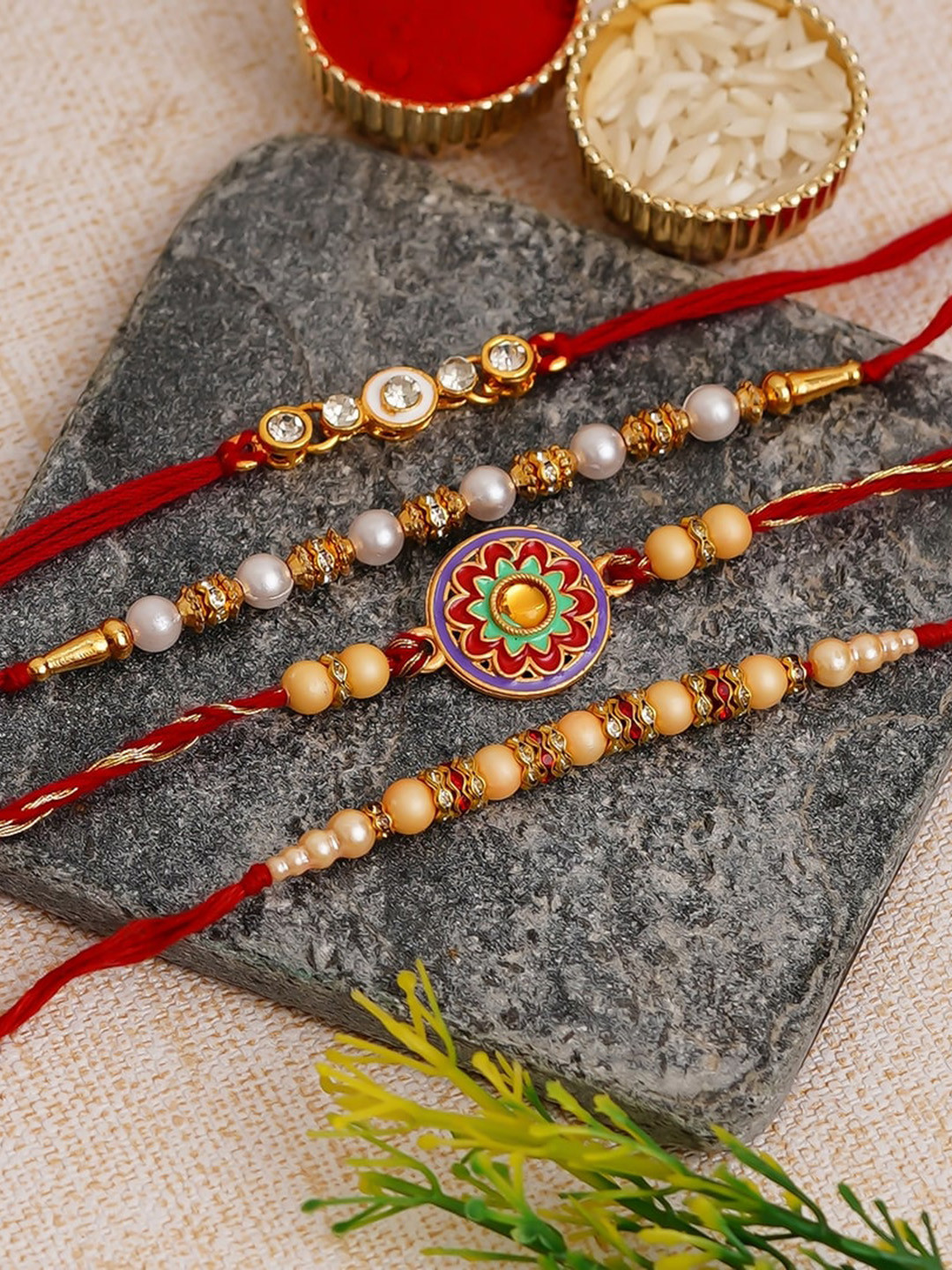 eCraftIndia Unisex Set of 4 Rakhis With Lakshmi Statue, Roli Chawal & Greeting Card